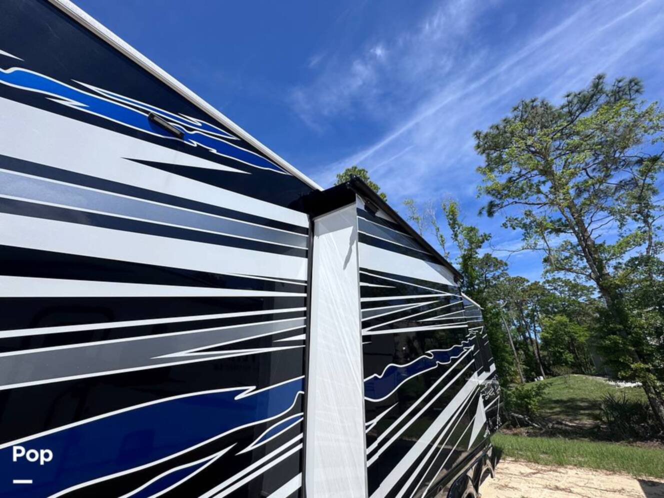 A photo of this 2023 Forest River Riverstone 45BATH Toy Hauler