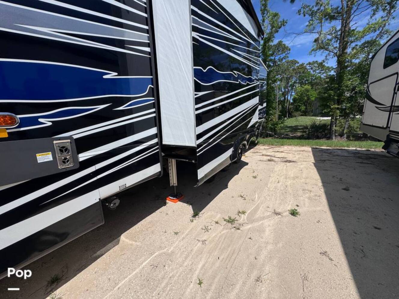 A photo of this 2023 Forest River Riverstone 45BATH Toy Hauler