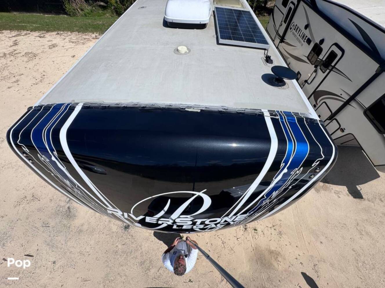 A photo of this 2023 Forest River Riverstone 45BATH Toy Hauler
