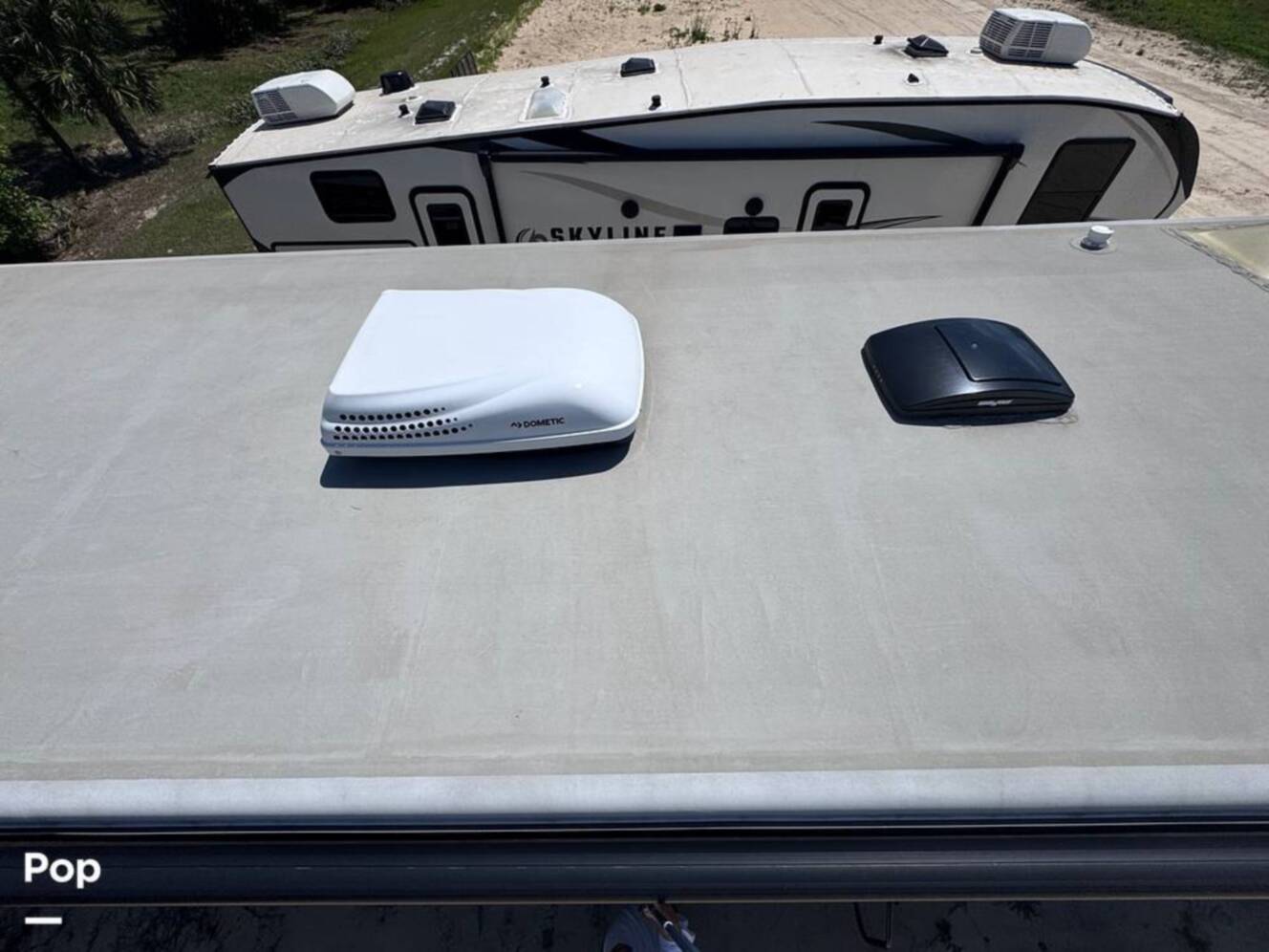 A photo of this 2023 Forest River Riverstone 45BATH Toy Hauler