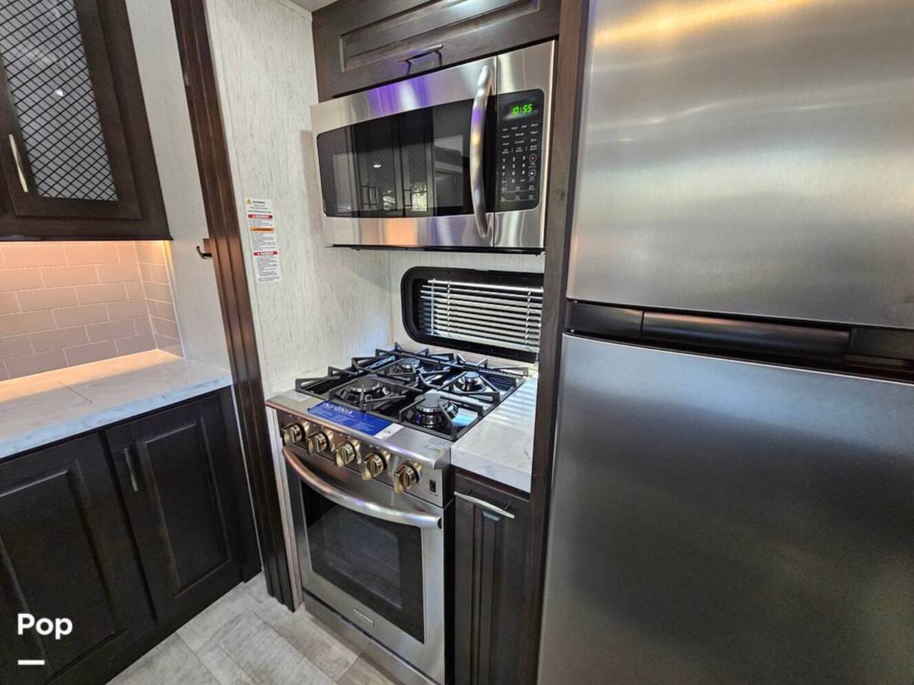 A photo of this 2023 Grand Design Momentum 398M