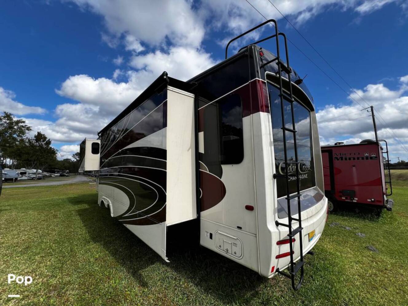 A photo of this 2019 Forest River Cedar Creek Champagne 38EL