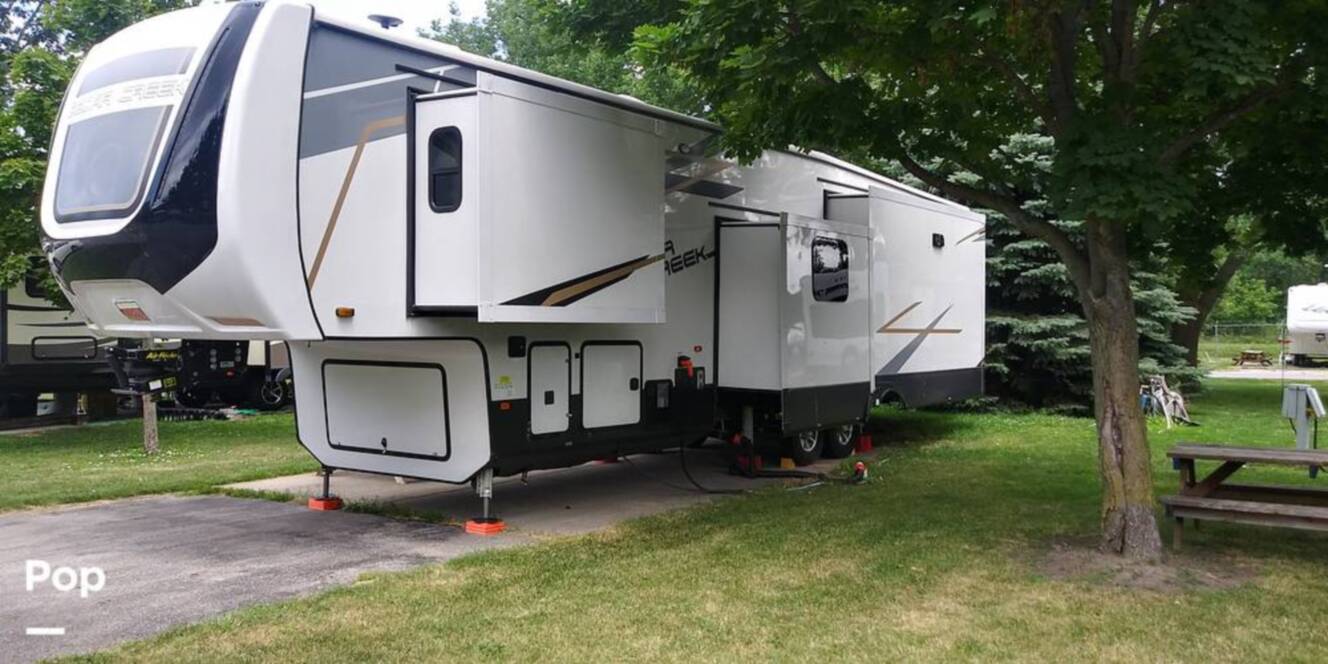 A photo of this 2021 Forest River Cedar Creek 377BH