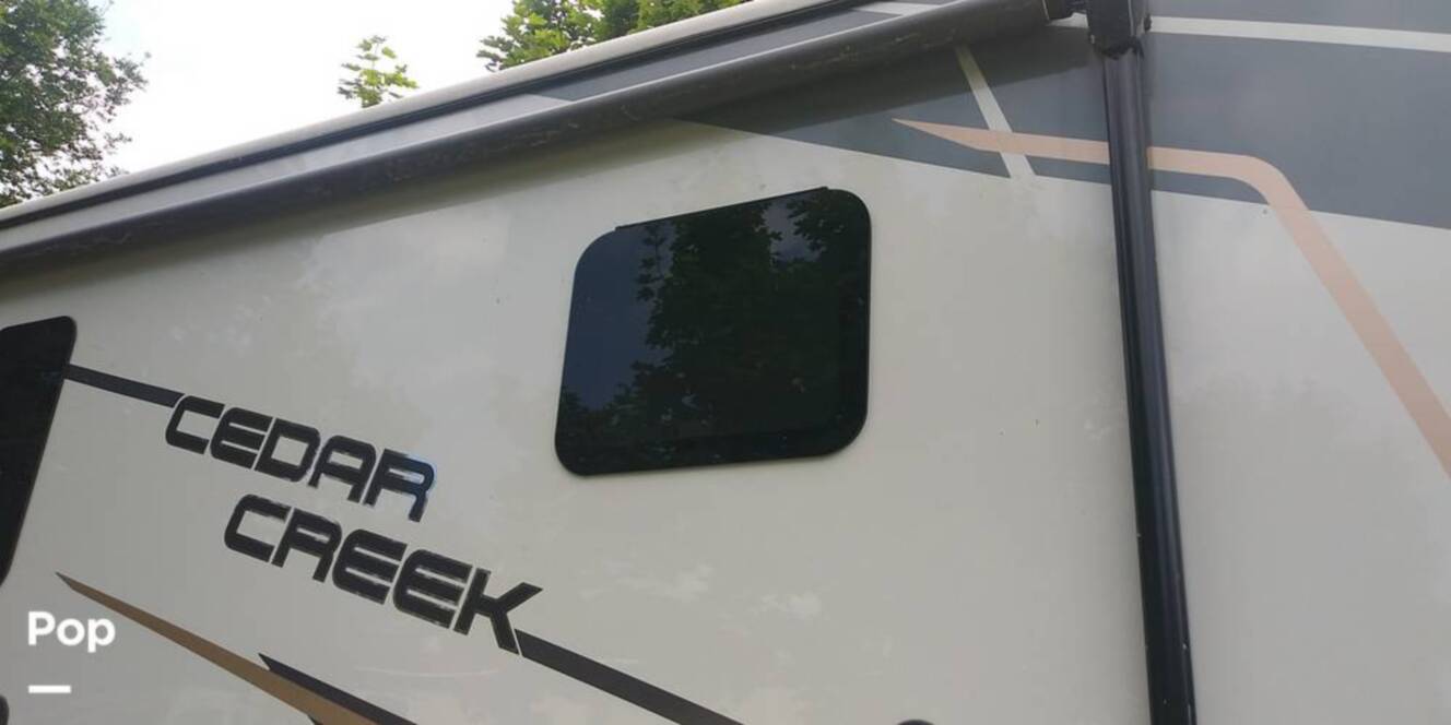 A photo of this 2021 Forest River Cedar Creek 377BH