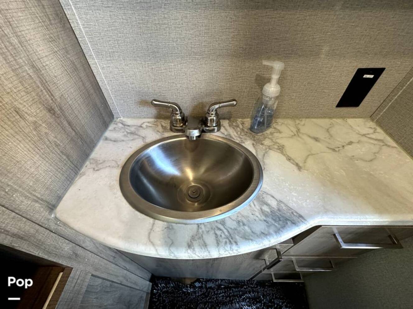 A photo of this 2022 Grand Design Imagine 2970RL