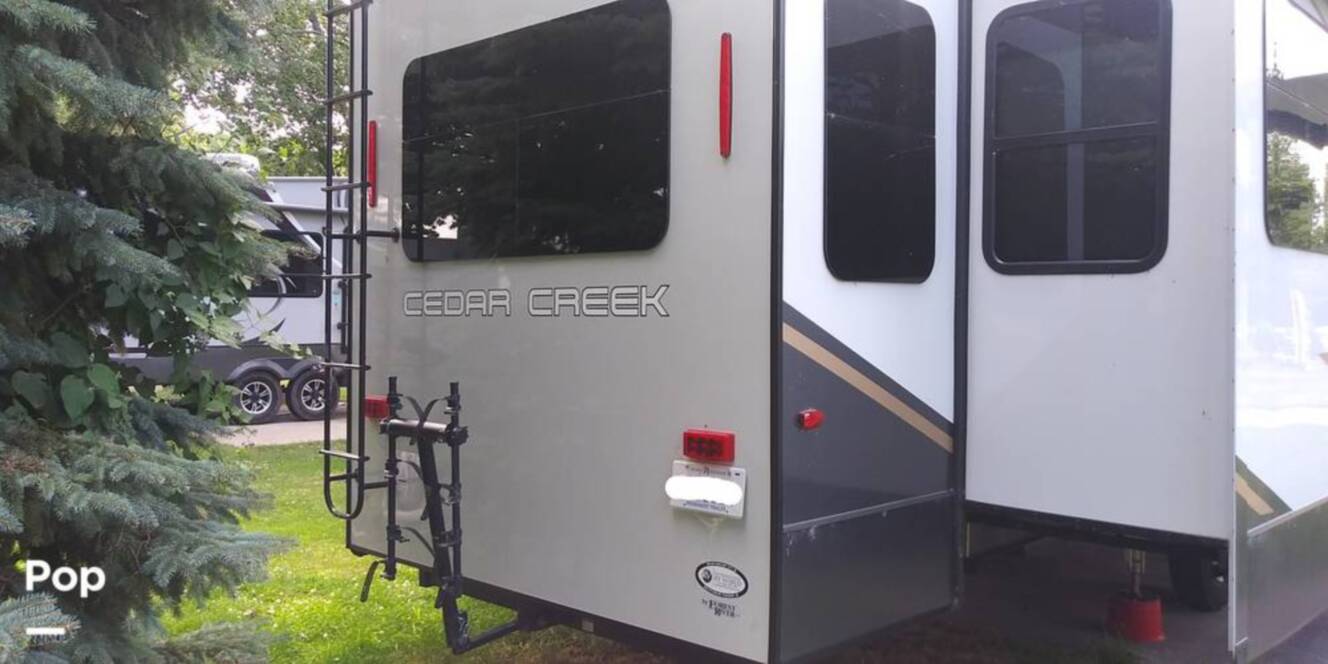 A photo of this 2021 Forest River Cedar Creek 377BH
