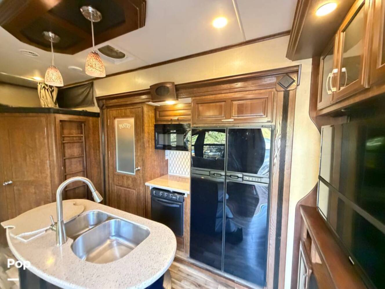 A photo of this 2015 Grand Design Momentum 385TH