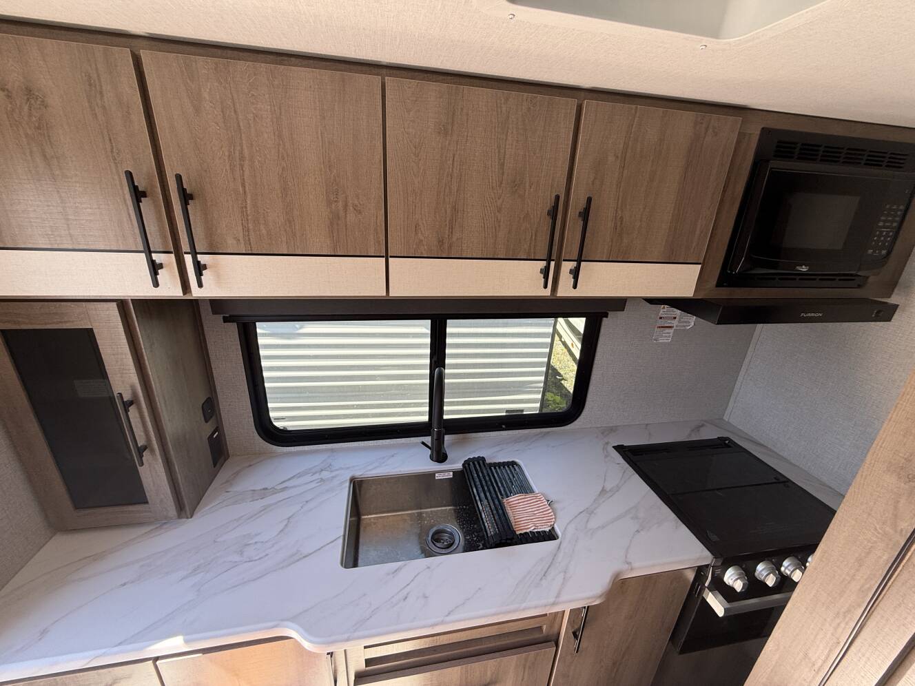 A photo of this 2023 Grand Design IMAGINE XLS 23LDE