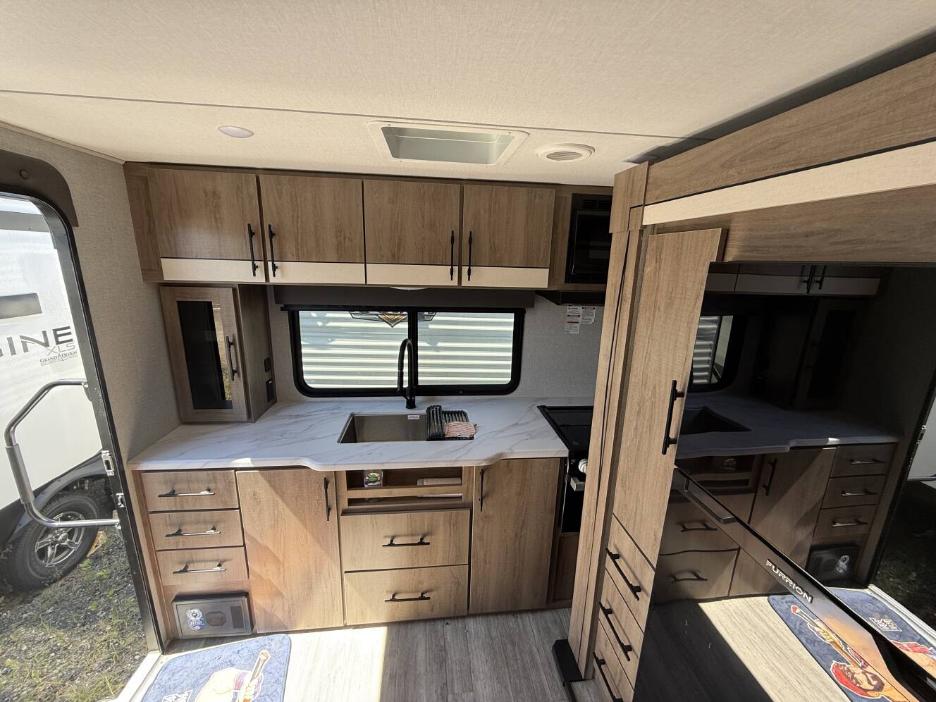 A photo of this 2023 Grand Design IMAGINE XLS 23LDE