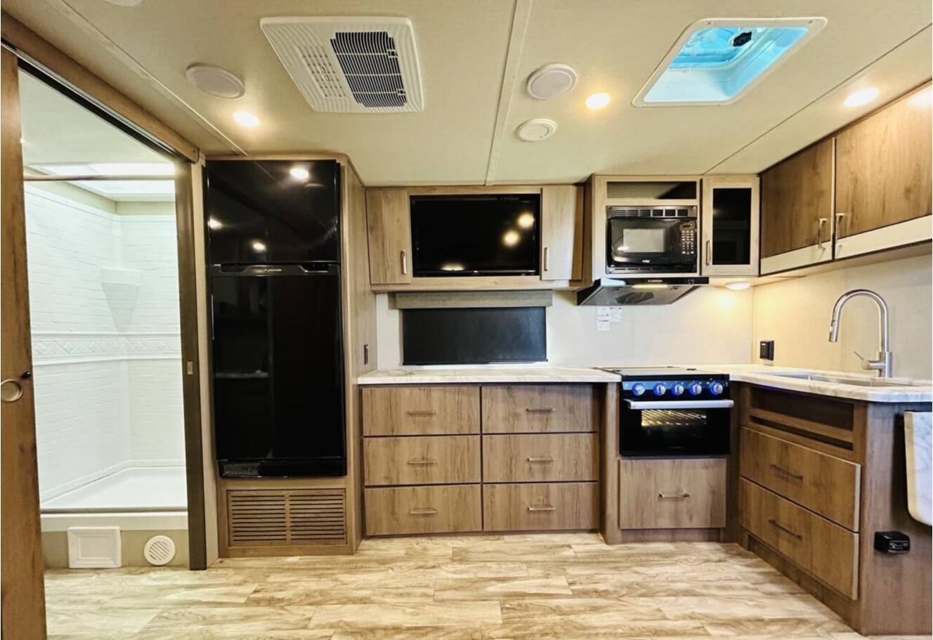 A photo of this 2022 Grand Design IMAGINE XLS 22RBE