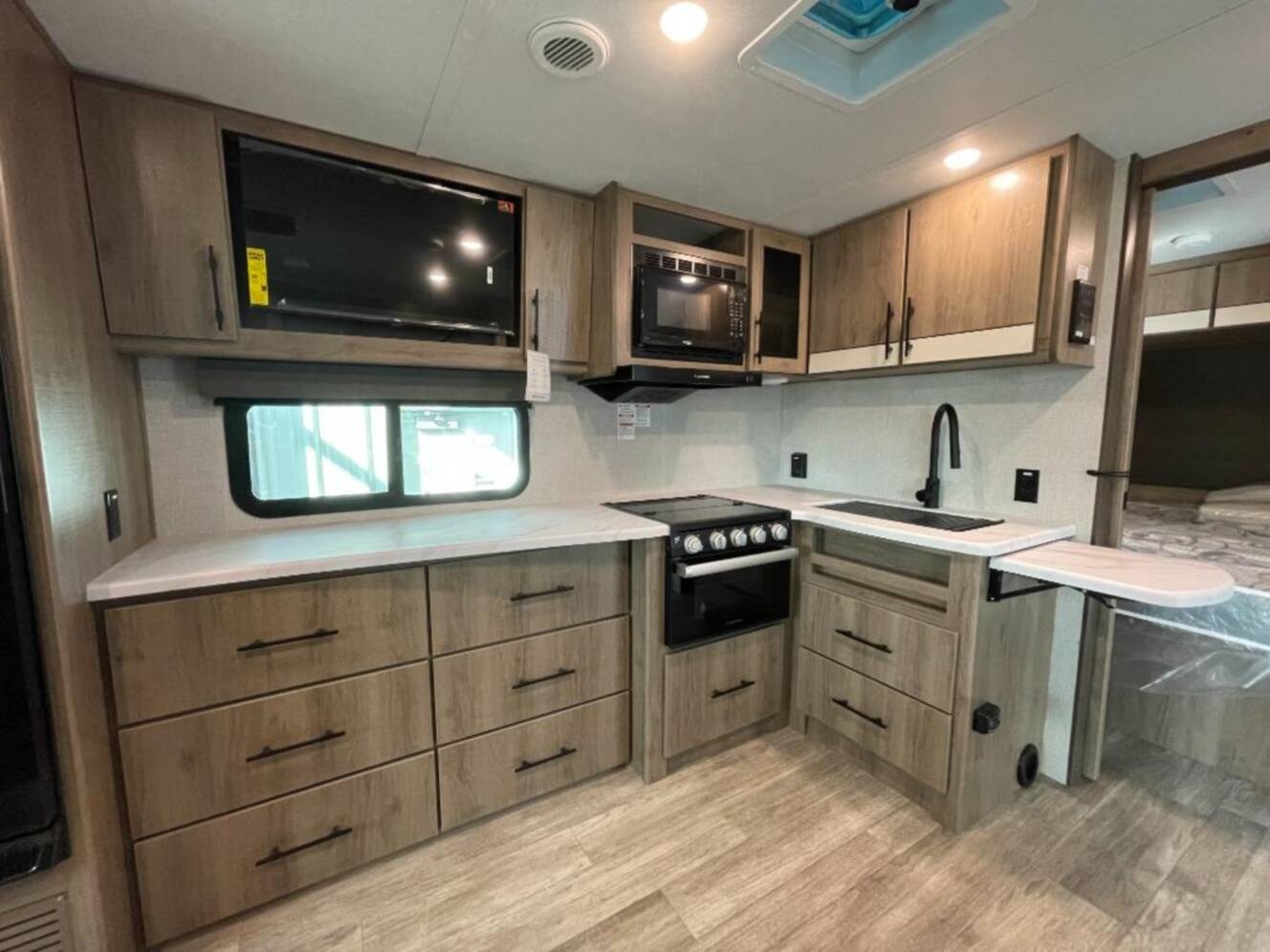 A photo of this 2022 Grand Design IMAGINE XLS 22RBE
