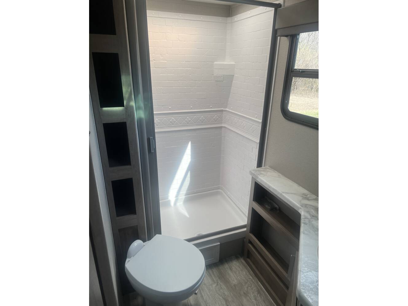A photo of this 2021 Grand Design IMAGINE XLS 21BHE