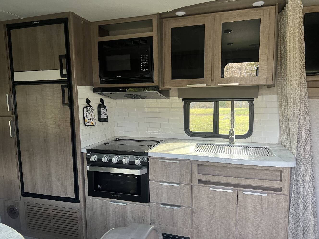 A photo of this 2021 Grand Design IMAGINE XLS 21BHE