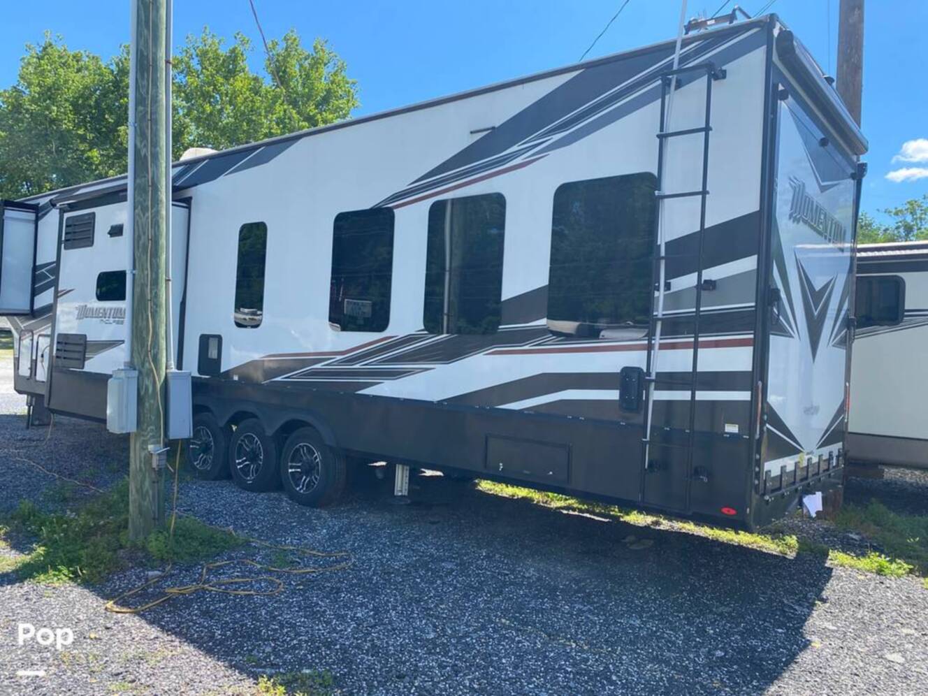 A photo of this 2022 Grand Design Momentum M-Class 398M