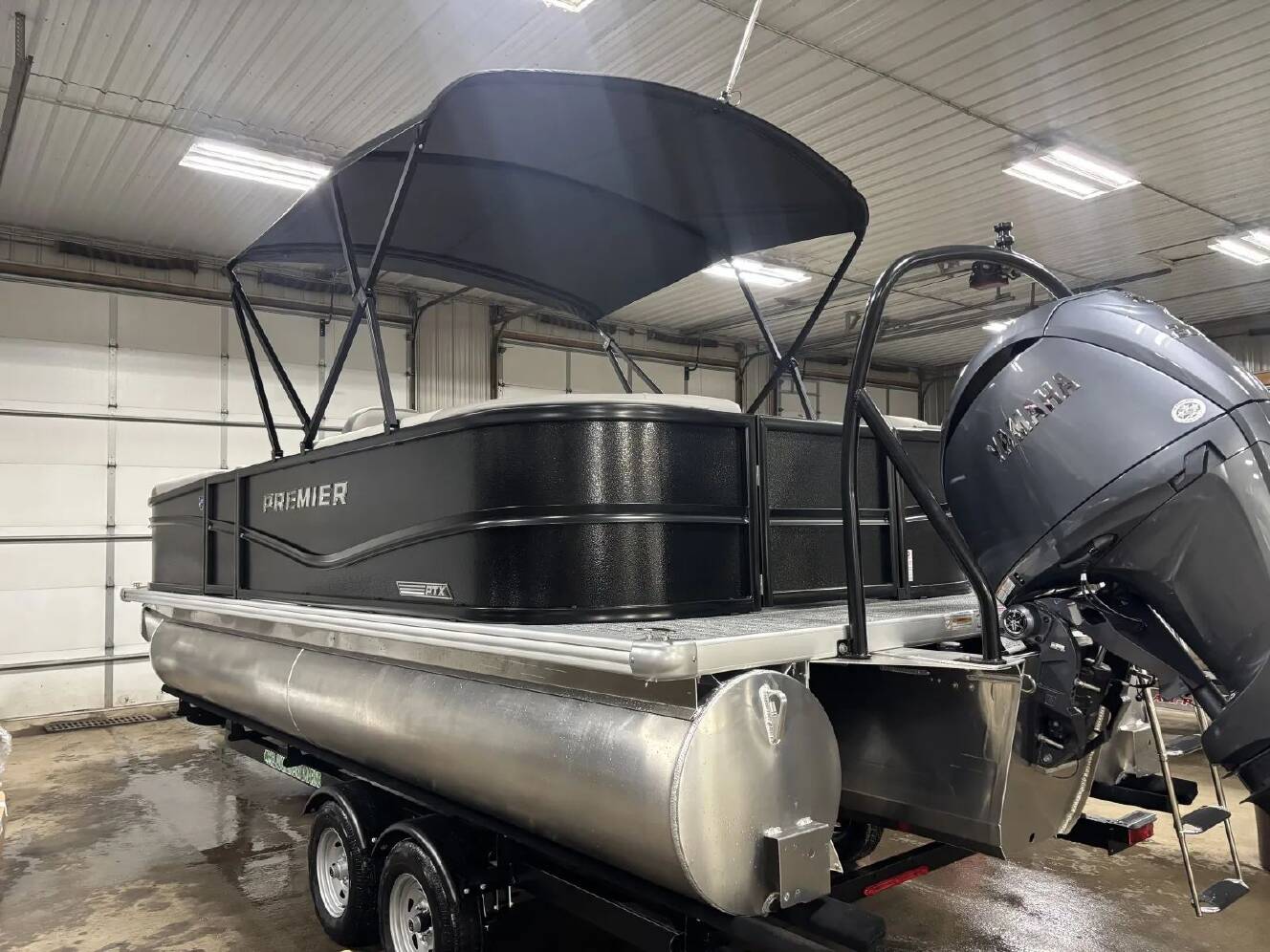 A photo of this 2026 Premier SUNSCAPE 220 RF PTX TRIPLE 200HP BUNK TRAILER