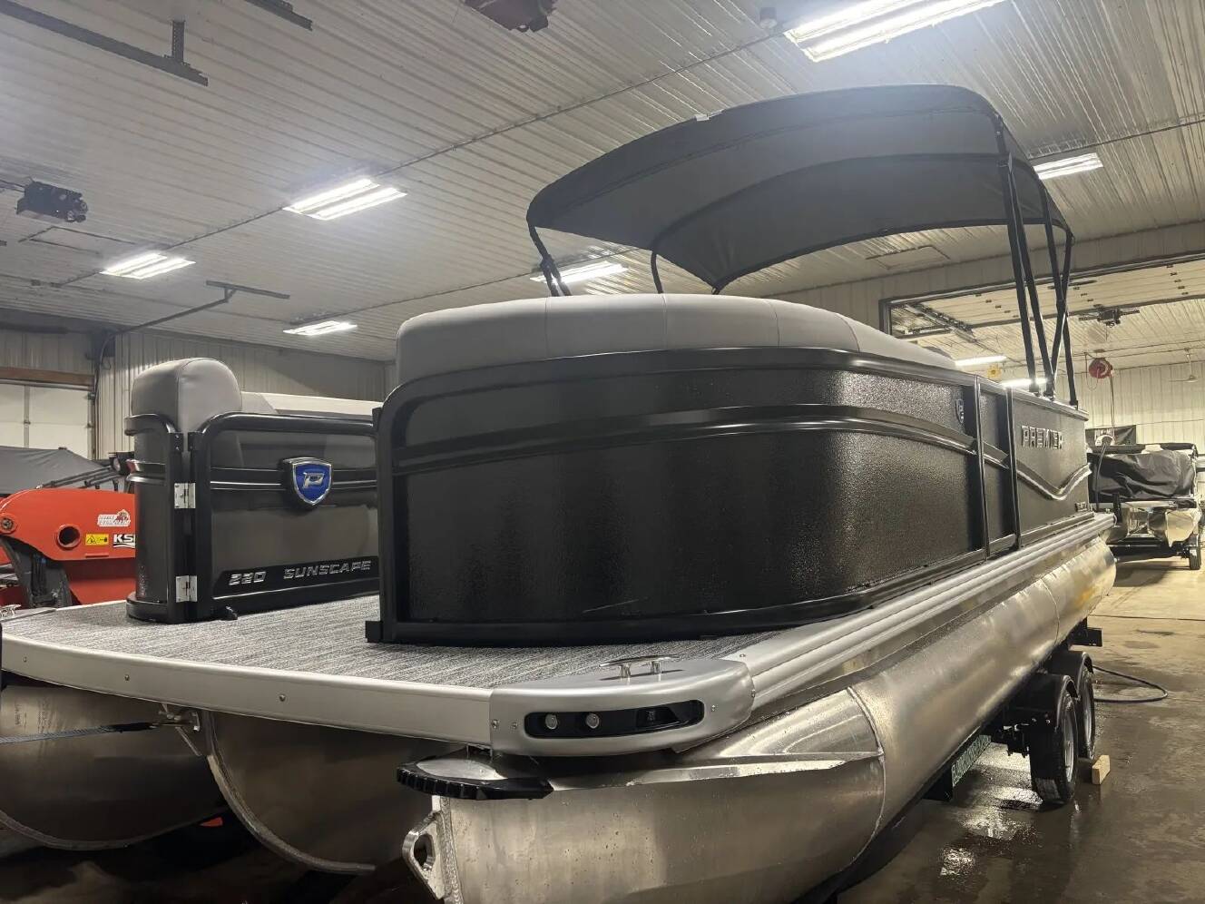 A photo of this 2026 Premier SUNSCAPE 220 RF PTX TRIPLE 200HP BUNK TRAILER