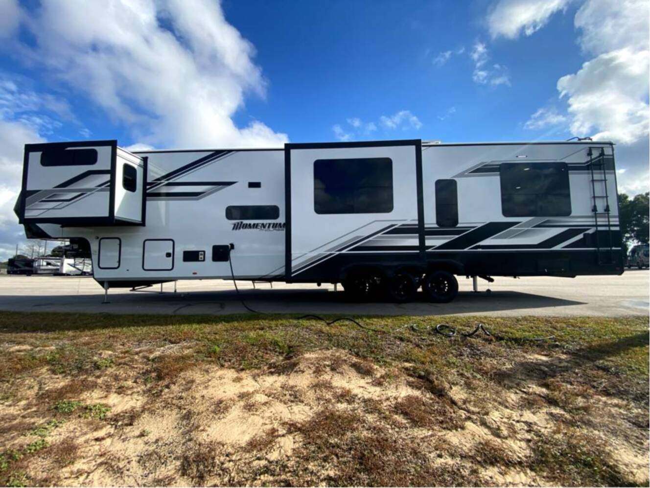 A photo of this 2026 Grand Design Momentum M-Class 414M