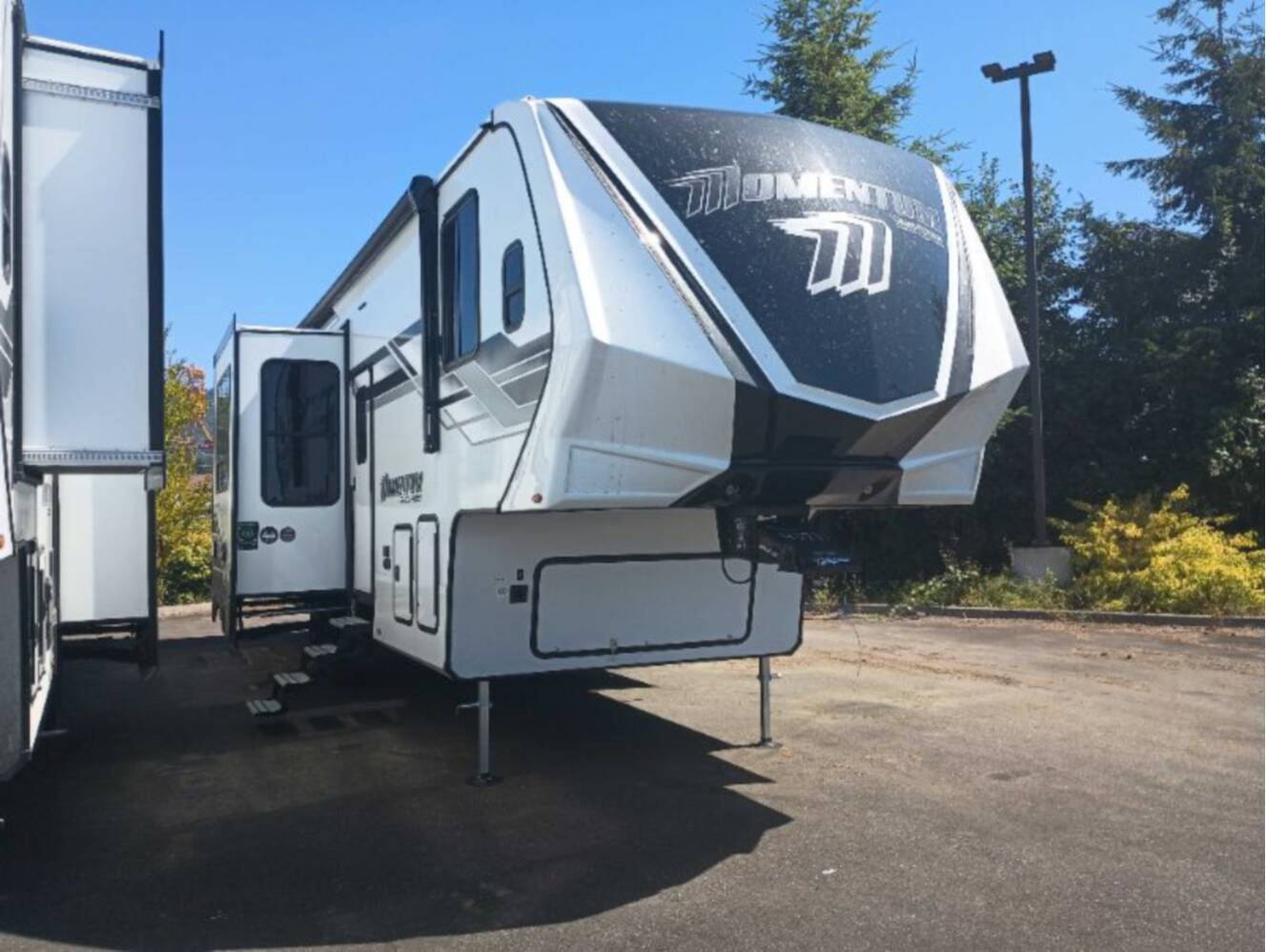 A photo of this 2026 Grand Design Momentum G-Class 320G