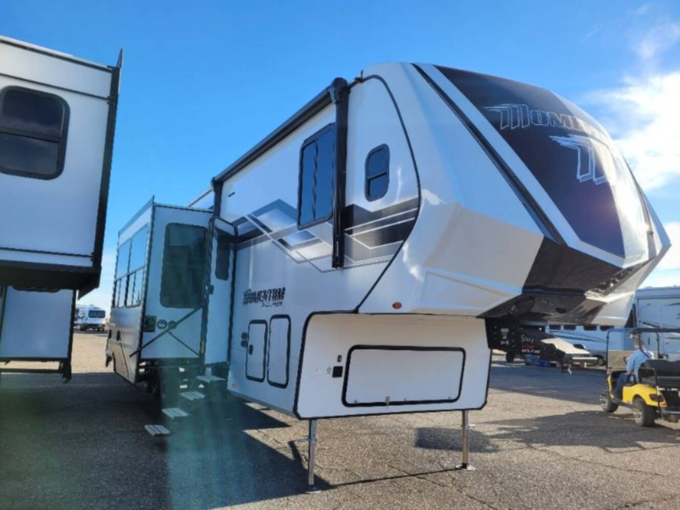 A photo of this 2026 Grand Design Momentum G-Class Fifth Wheel 394G