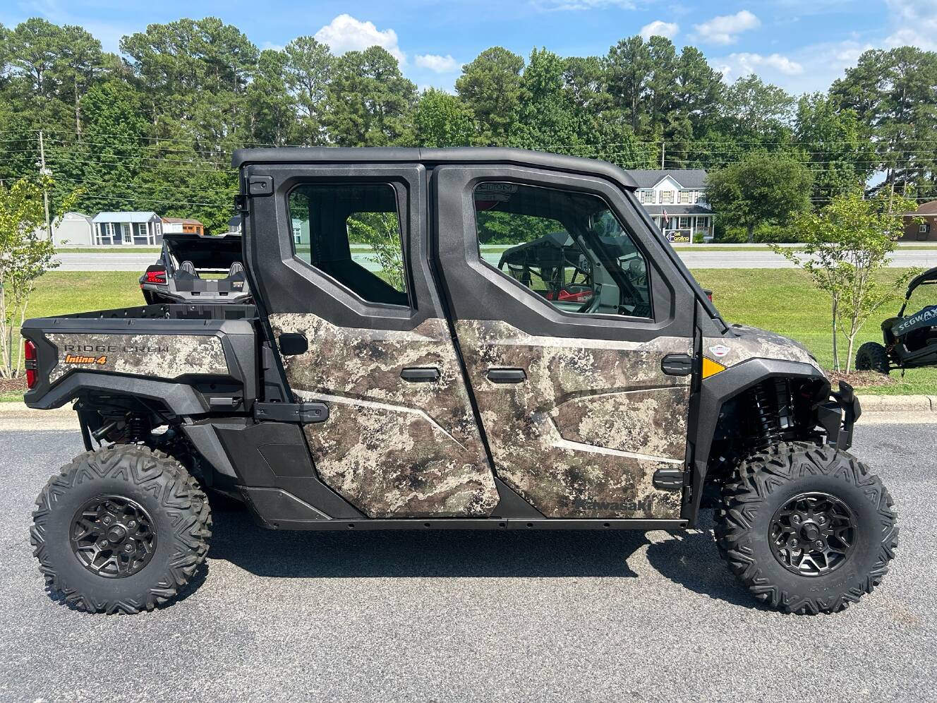 A photo of this 2026 Kawasaki RIDGE® CREW HVAC Camo