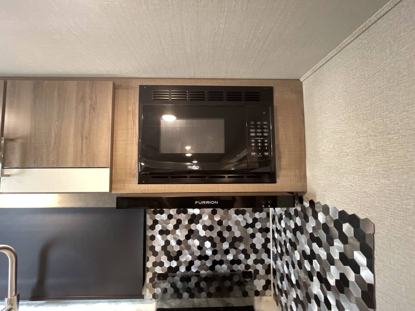 A photo of this 2022 Grand Design IMAGINE XLS 23LDE