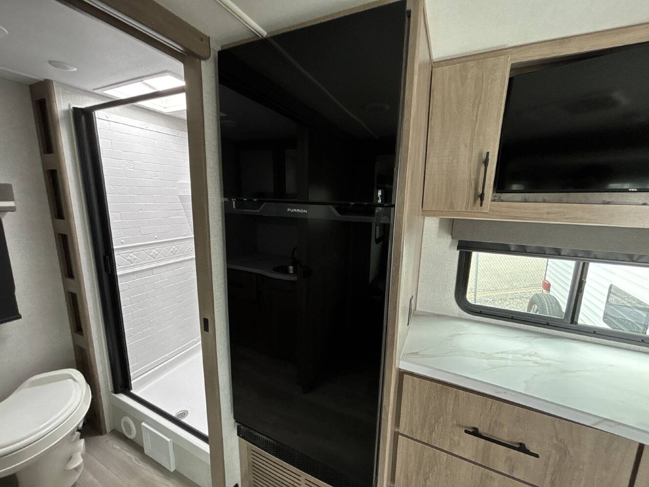 A photo of this 2024 Grand Design IMAGINE XLS 22RBE