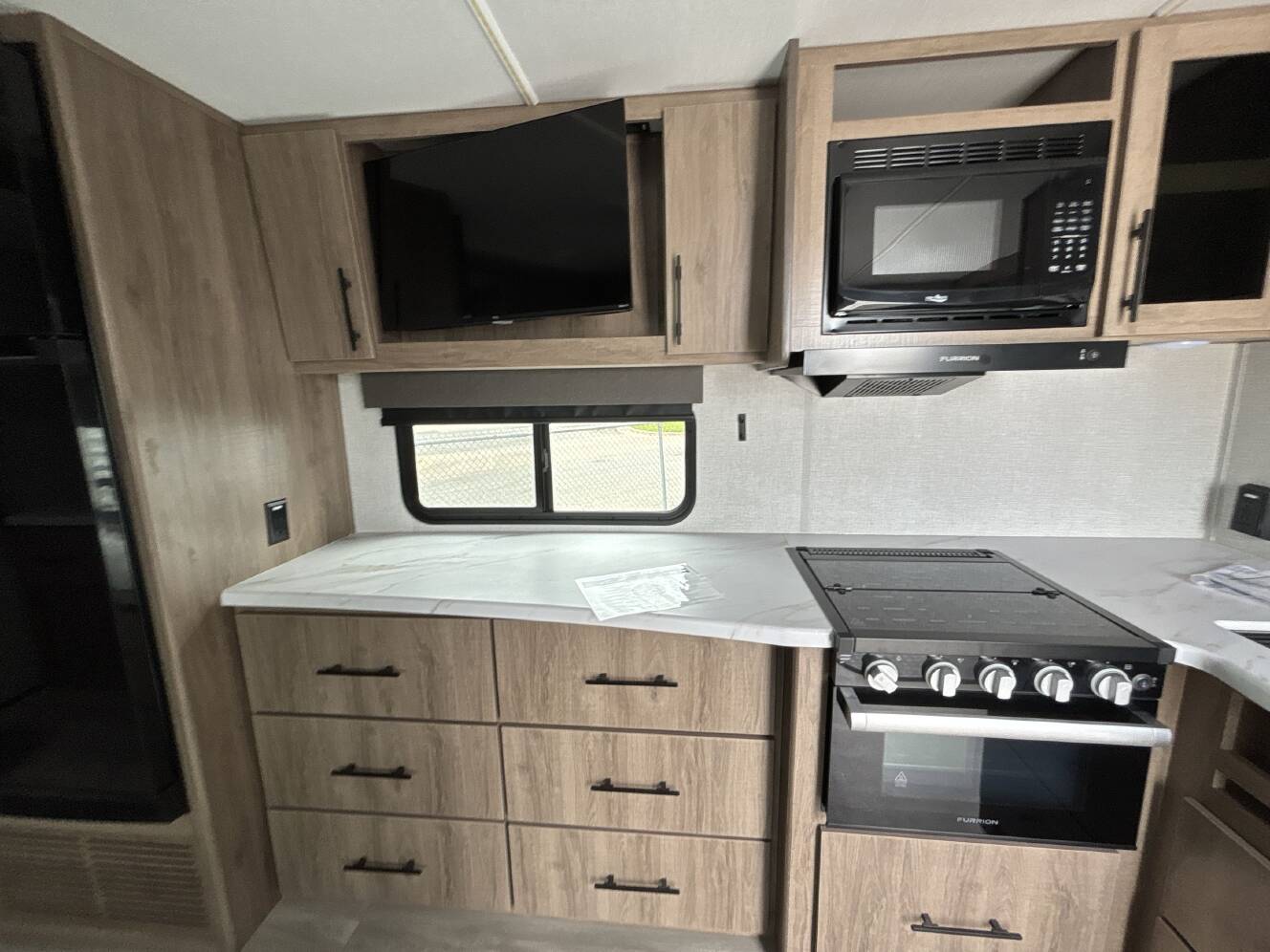 A photo of this 2024 Grand Design IMAGINE XLS 22RBE