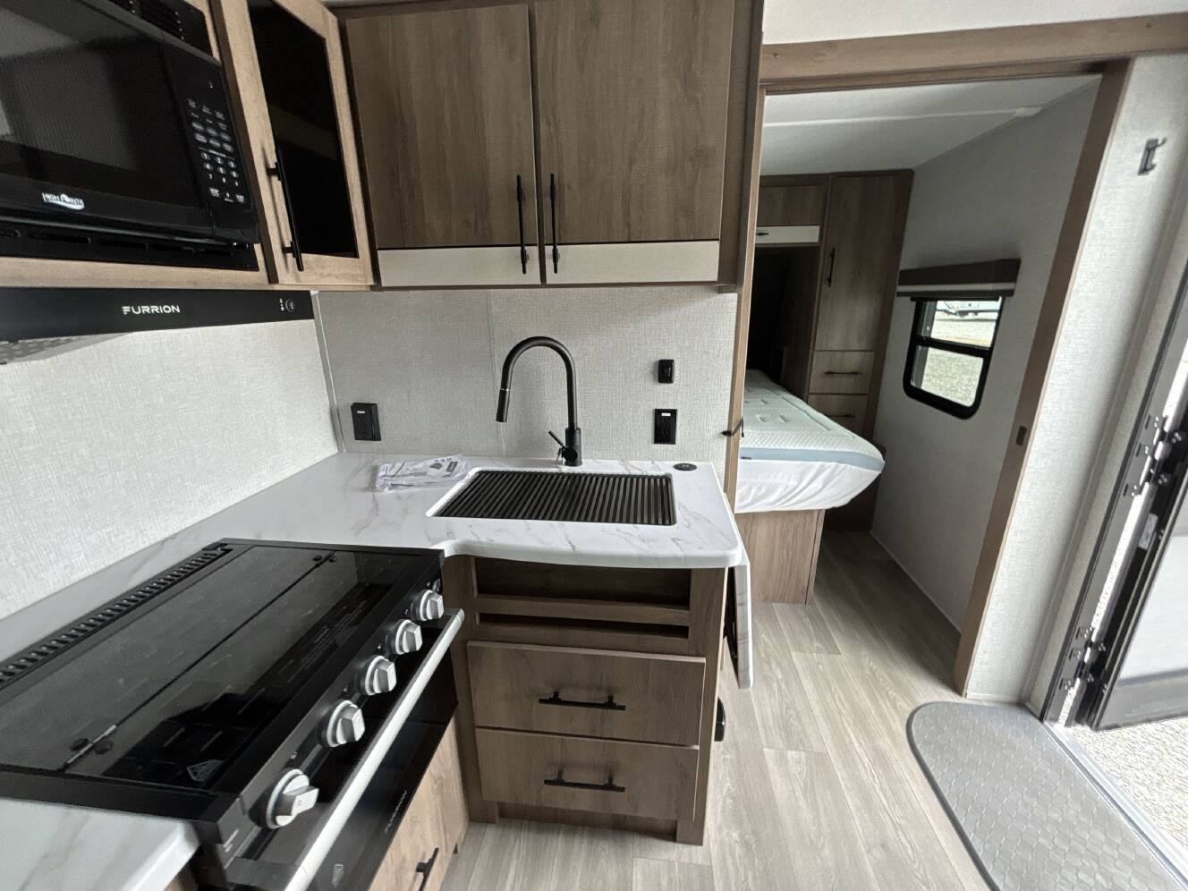 A photo of this 2024 Grand Design IMAGINE XLS 22RBE