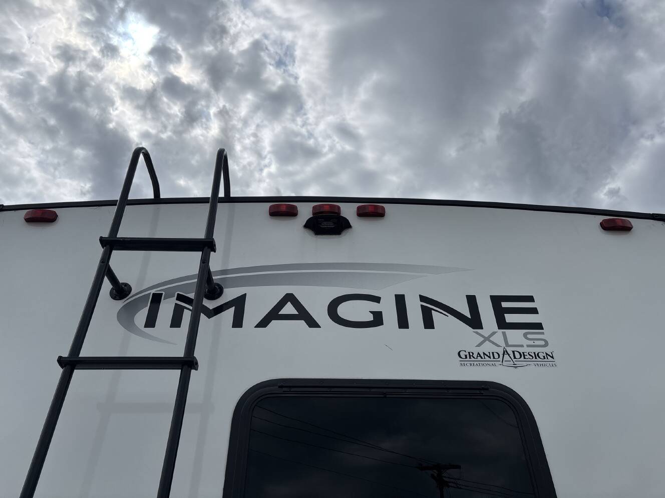 A photo of this 2024 Grand Design IMAGINE XLS 22RBE