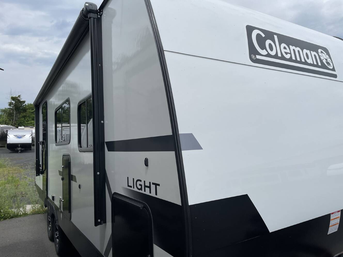 A photo of this 2027 Keystone COLEMAN LIGHT 22BX