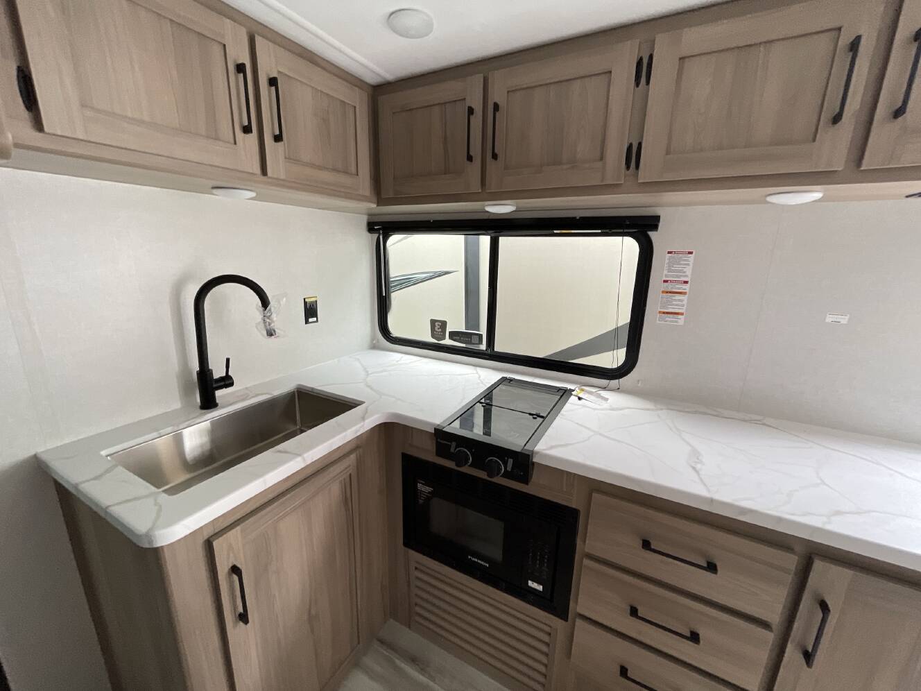 A photo of this 2027 Keystone COLEMAN LIGHT 22BX