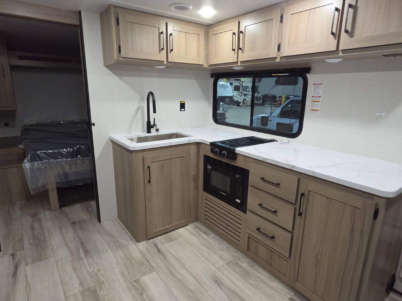A photo of this 2027 Keystone COLEMAN LIGHT 22BX