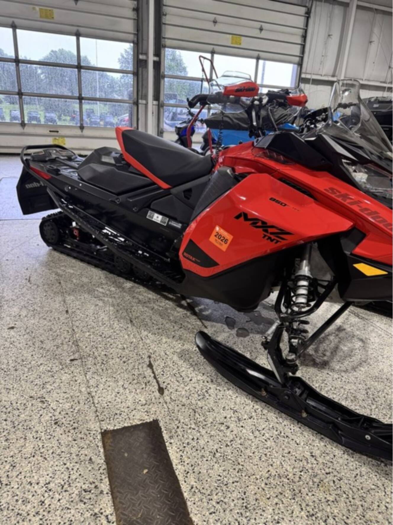 A photo of this 2021 Ski-Doo MXZ® TNT® Rotax® 850 E-TEC® Ripsaw 1.25 Lava Red