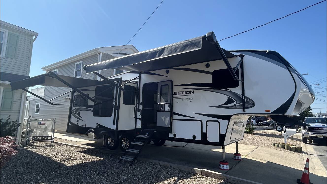 A photo of this 2021 Grand Design REFLECTION 303RLS