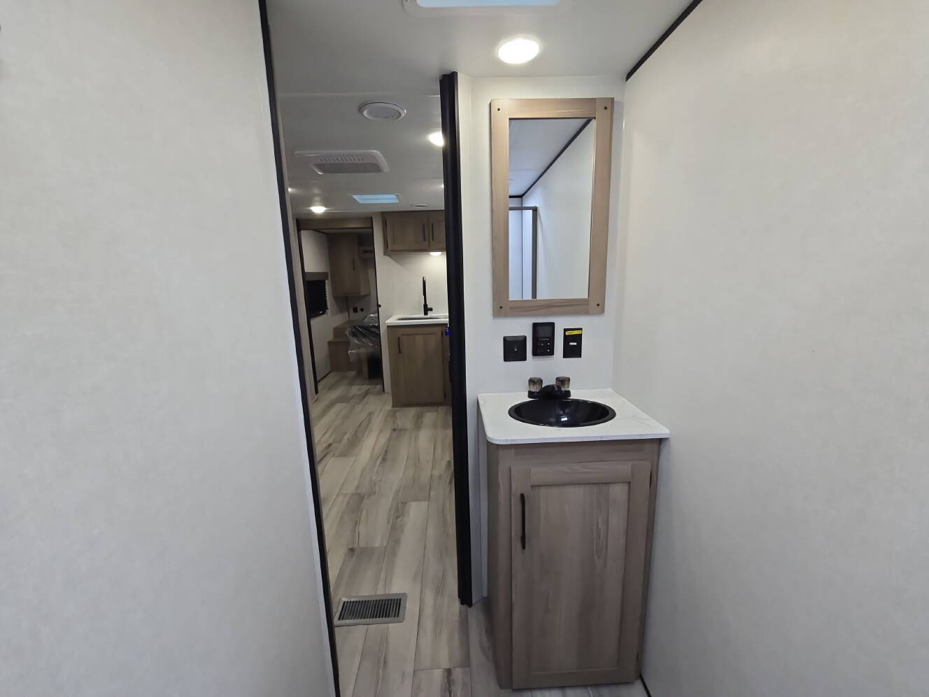 A photo of this 2027 Keystone COLEMAN LIGHT 22BX