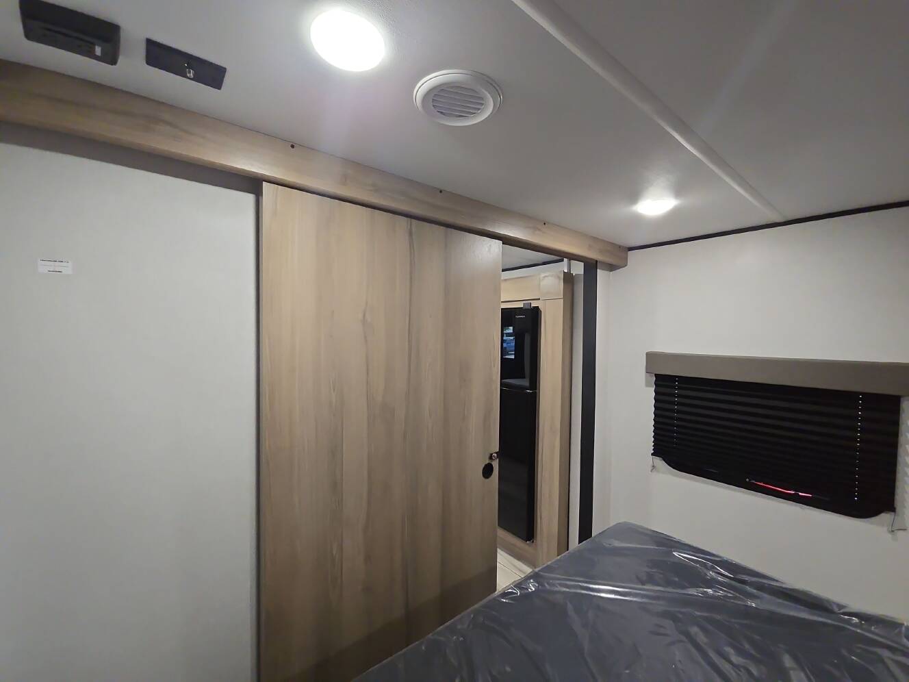 A photo of this 2027 Keystone COLEMAN LIGHT 22BX