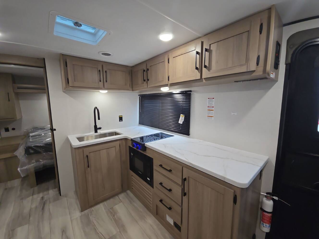 A photo of this 2027 Keystone COLEMAN LIGHT 22BX