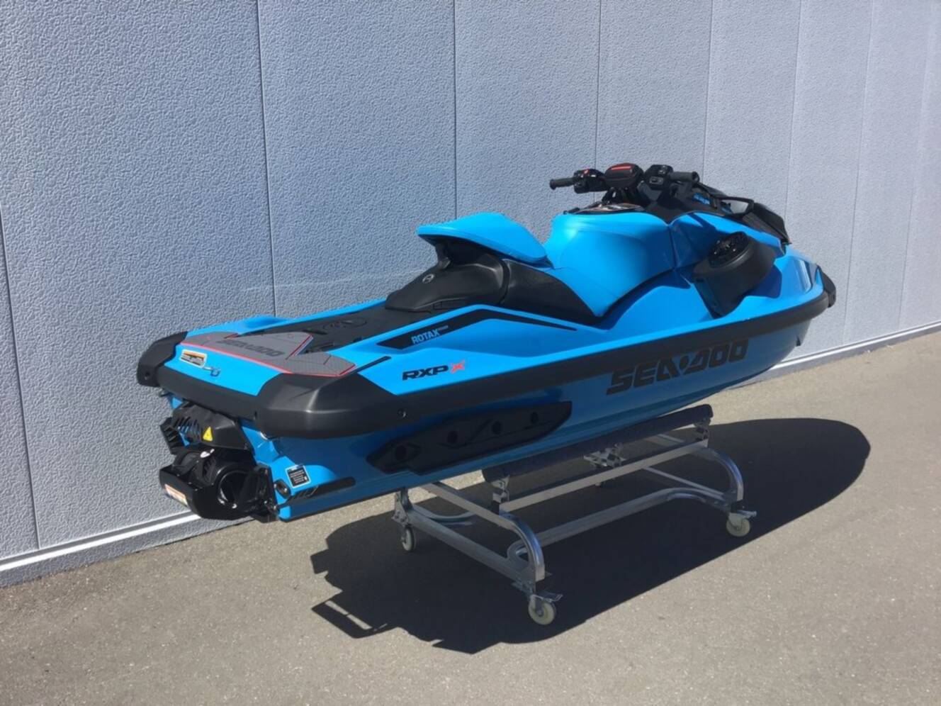 A photo of this 2026 Sea-Doo RXP-X 325 Tech, BRP Premium A, iBR Gulfstream Blue P