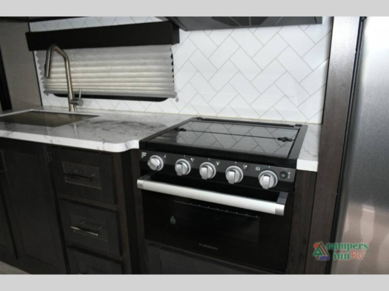 A photo of this 2023 Grand Design Momentum 21G