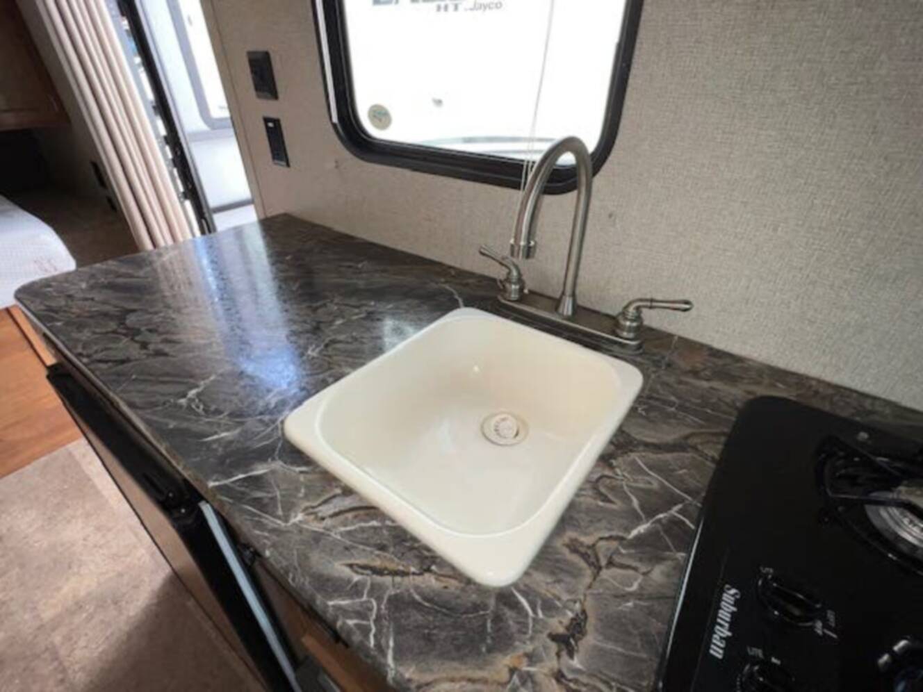 A photo of this 2018 Keystone Springdale Summerland Mini 1750RD Front East-West Queen
