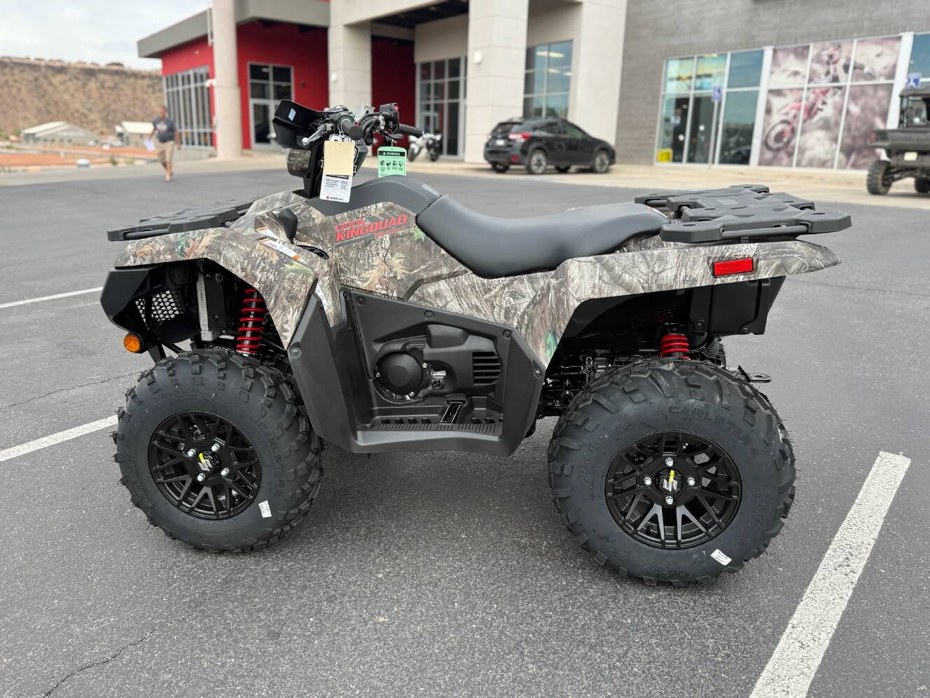 A photo of this 2025 Suzuki KingQuad 500AXi Power Steering SE Camo