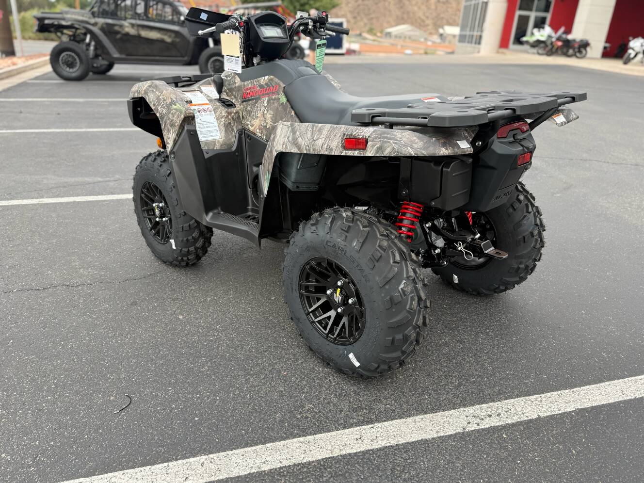 A photo of this 2025 Suzuki KingQuad 500AXi Power Steering SE Camo