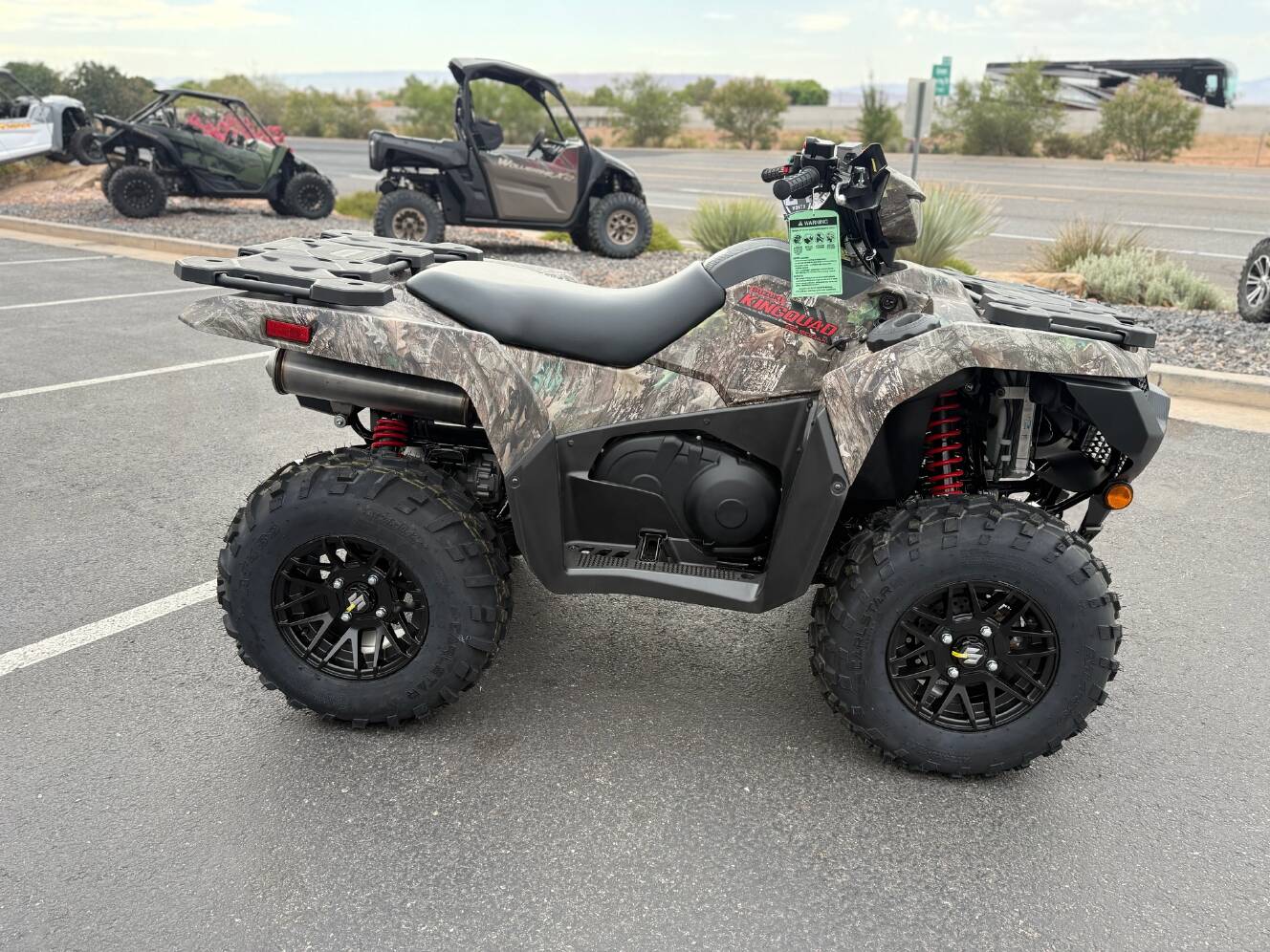 A photo of this 2025 Suzuki KingQuad 500AXi Power Steering SE Camo