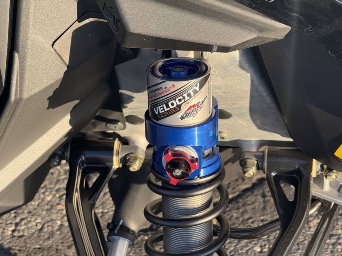 A photo of this 2026 Polaris 850 RMK Khaos 165 Gloss Black / Blue Dusk 850