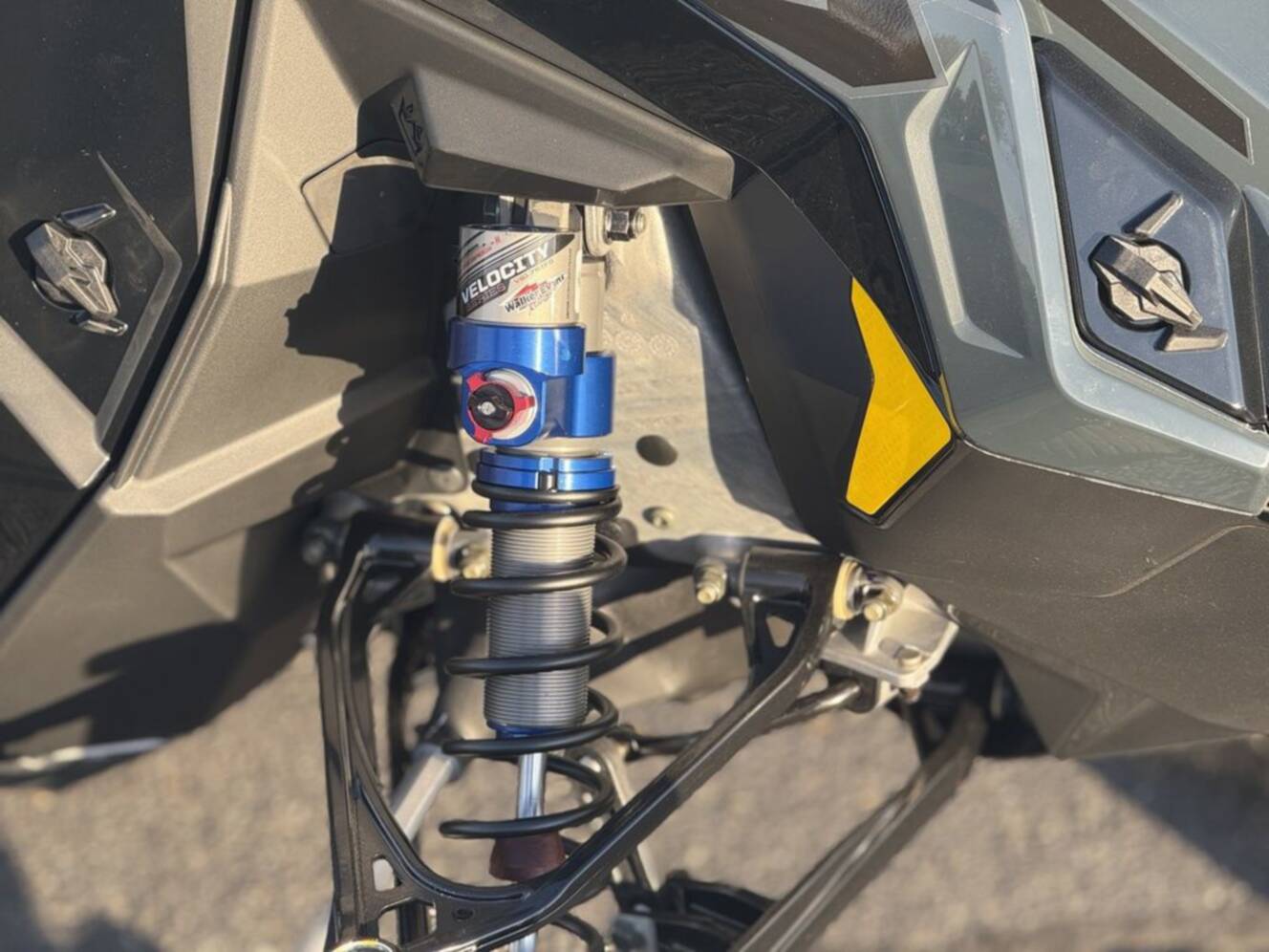 A photo of this 2026 Polaris 850 RMK Khaos 165 Gloss Black / Blue Dusk 850