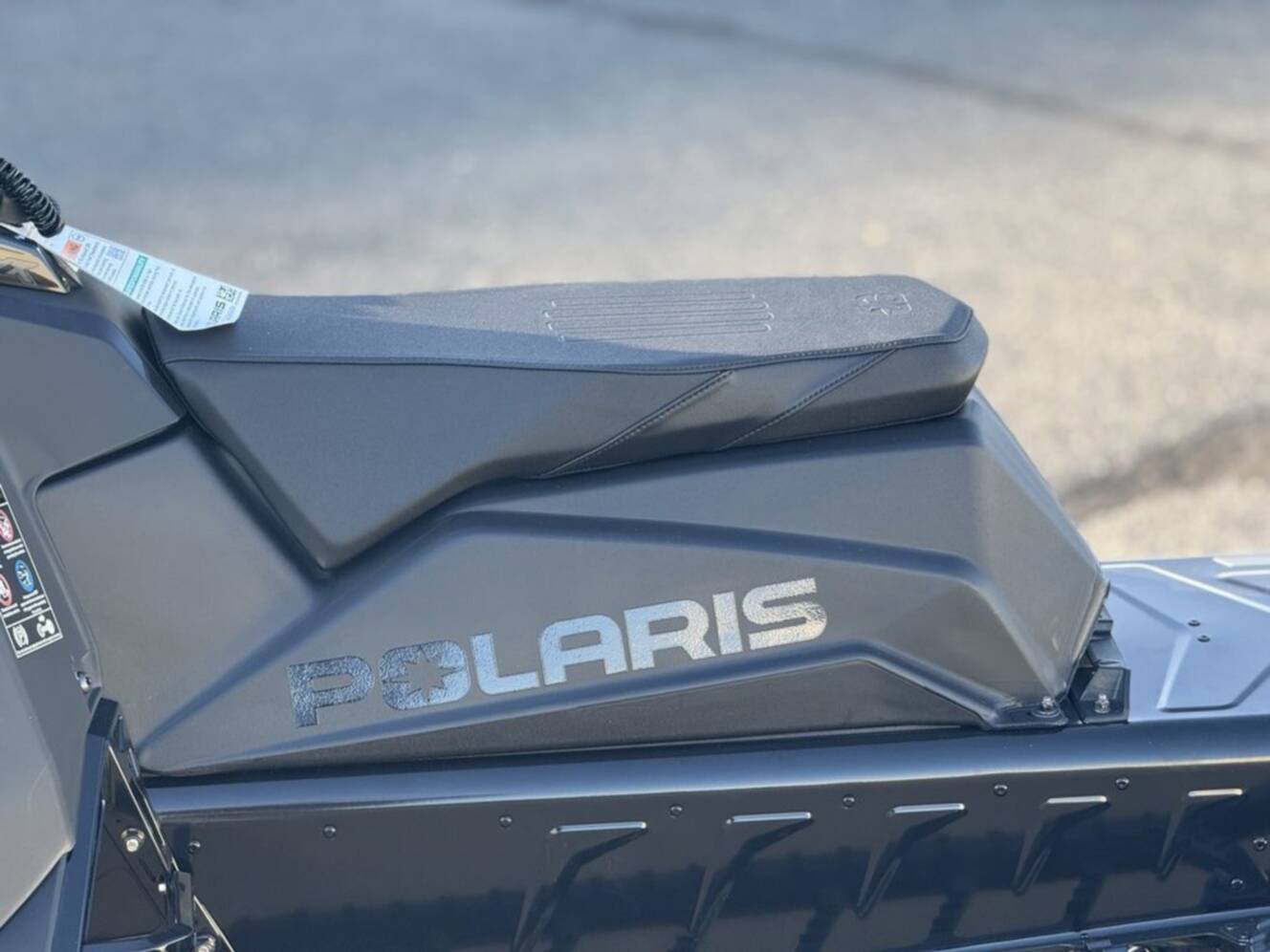 A photo of this 2026 Polaris 850 RMK Khaos 165 Gloss Black / Blue Dusk 850