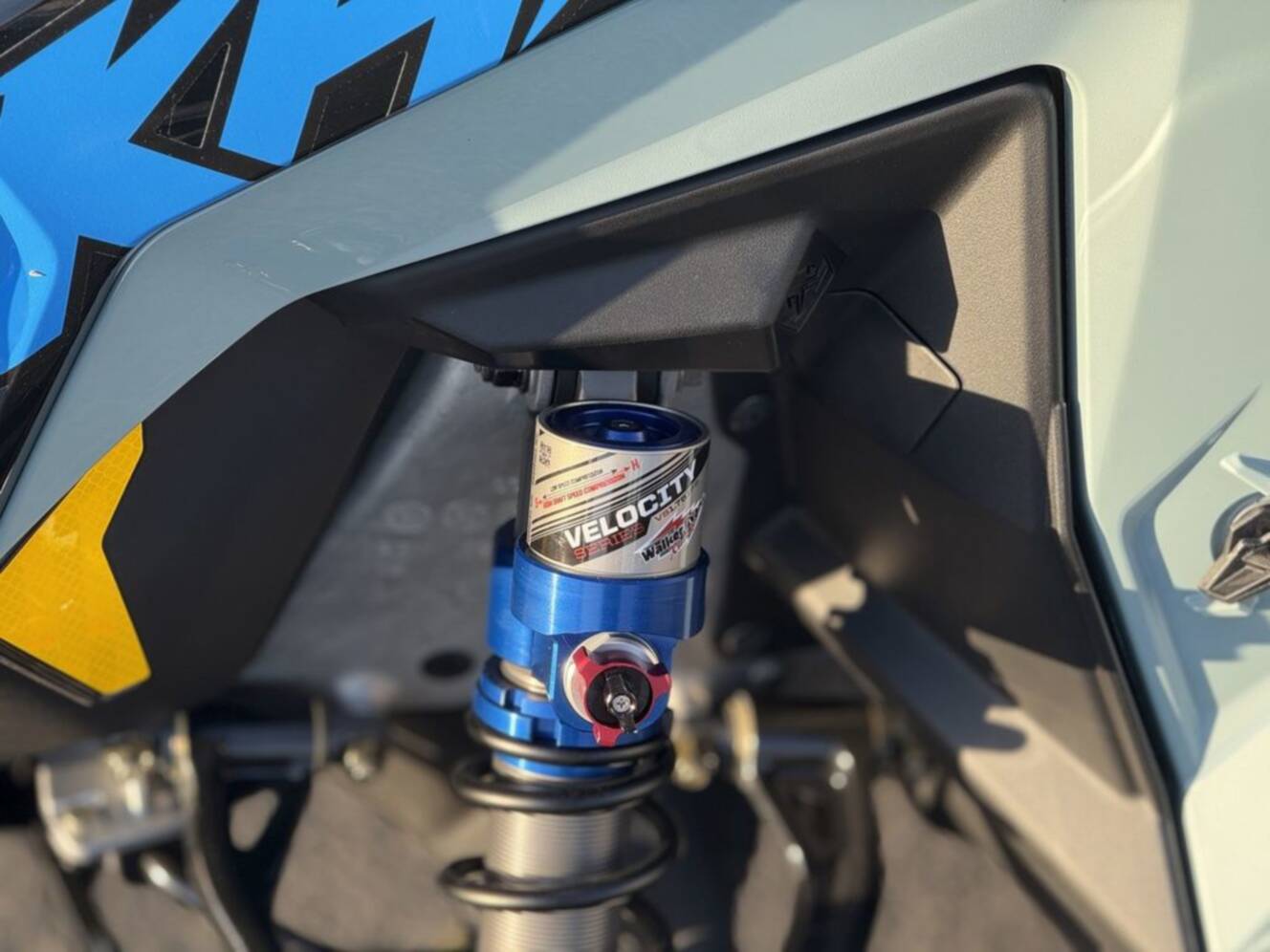 A photo of this 2026 Polaris 850 RMK Khaos 155 Gloss Black / Blue Dusk 850