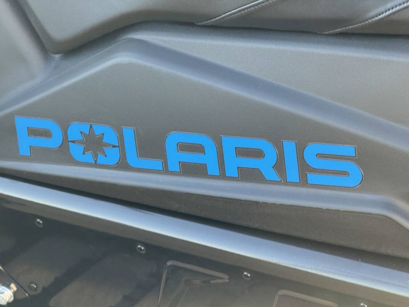 A photo of this 2026 Polaris 850 RMK Khaos 155 Gloss Black / Blue Dusk 850