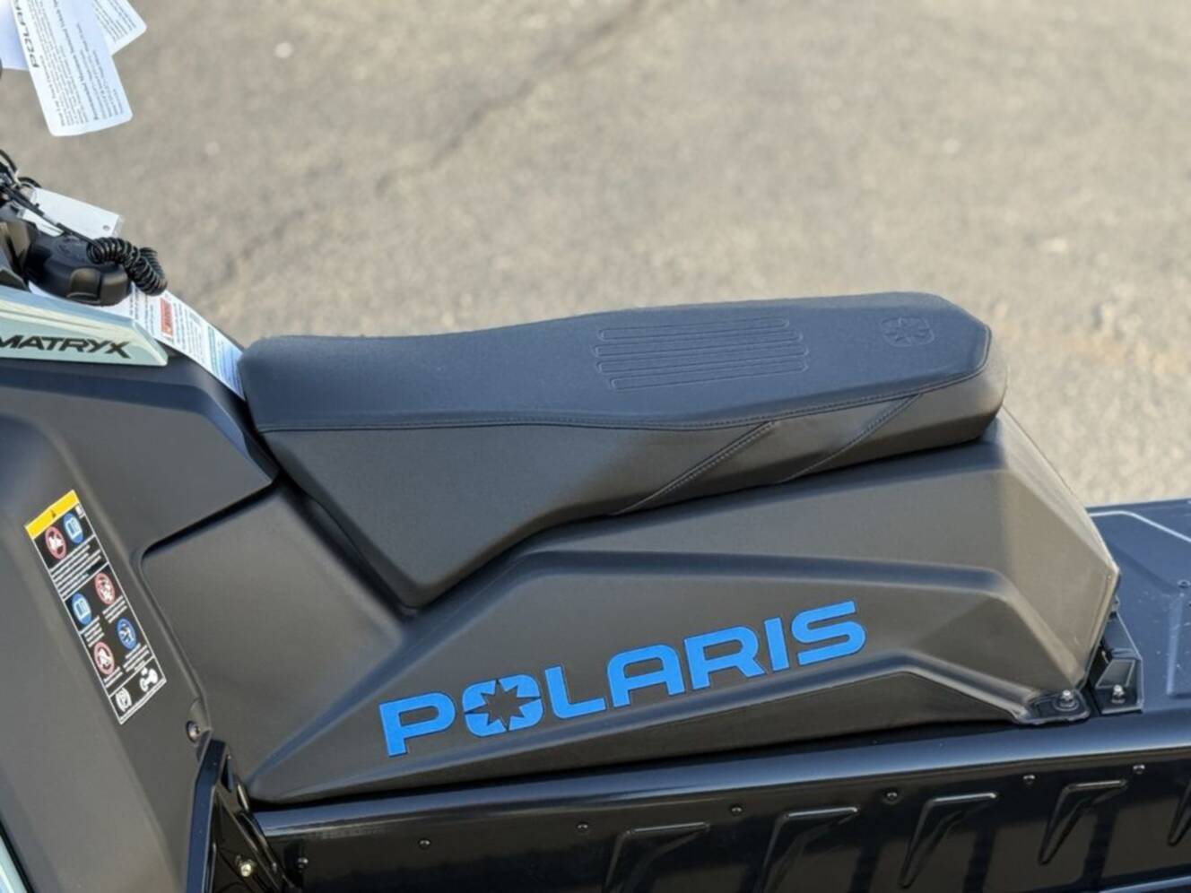A photo of this 2026 Polaris 850 RMK Khaos 155 Gloss Black / Blue Dusk 850