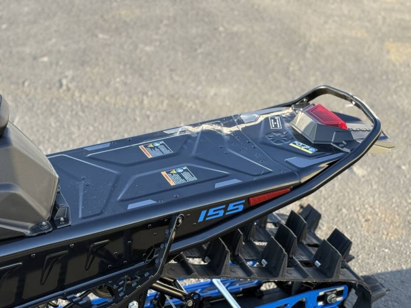 A photo of this 2026 Polaris 850 RMK Khaos 155 Gloss Black / Blue Dusk 850